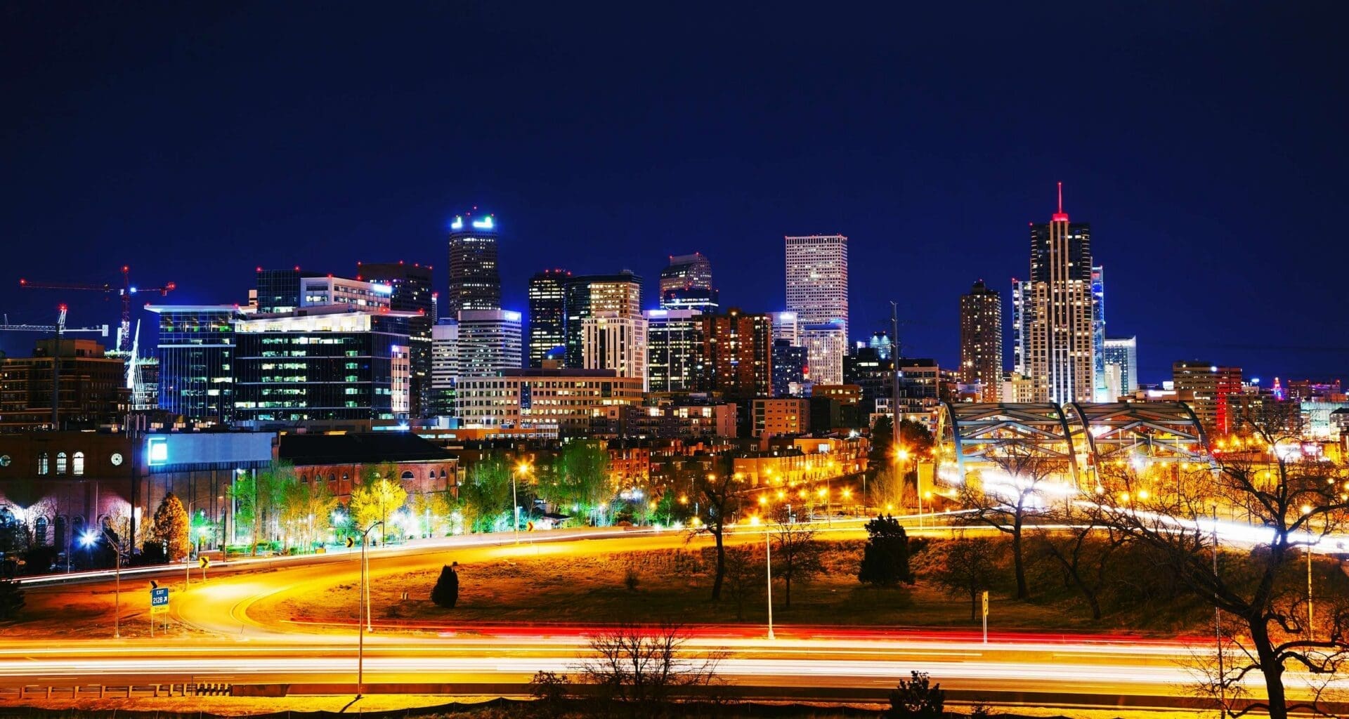 Denver skyline at night: the Denver Metro market where selling a house in Littleton CO starts online