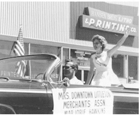 Historic photo of the Western Welcome Week parade marching through downtown Littleton, Colorado
