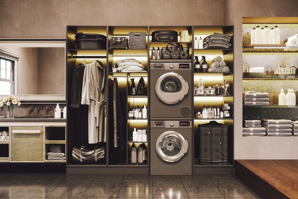Luxury laundry room with stacked washer and dryer and backlit organized shelving